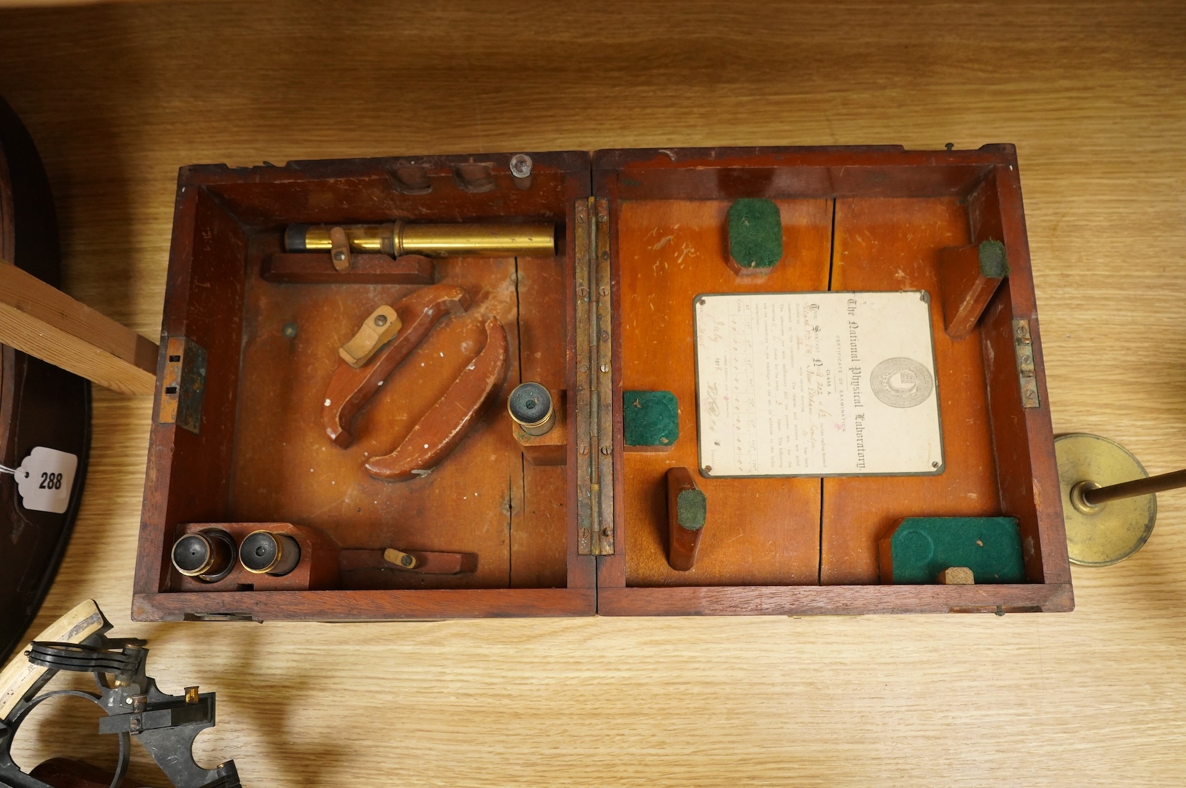 An early 20th century brass and lacquered sextant without maker’s mark, the mahogany case containing three eyepieces, card certificate of examination by the National Physical Laboratory screwed to the inside of the lid a